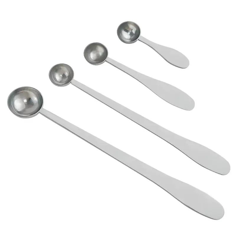 ZEST stainless steel measuring scoops in four sizes with long flat handles on a white background